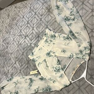 Long sleeve flowery see through arms.